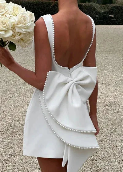 Pearl Trim High Neck Sleeveless Pleated Bow Back Fit and Flare Mini Dress
