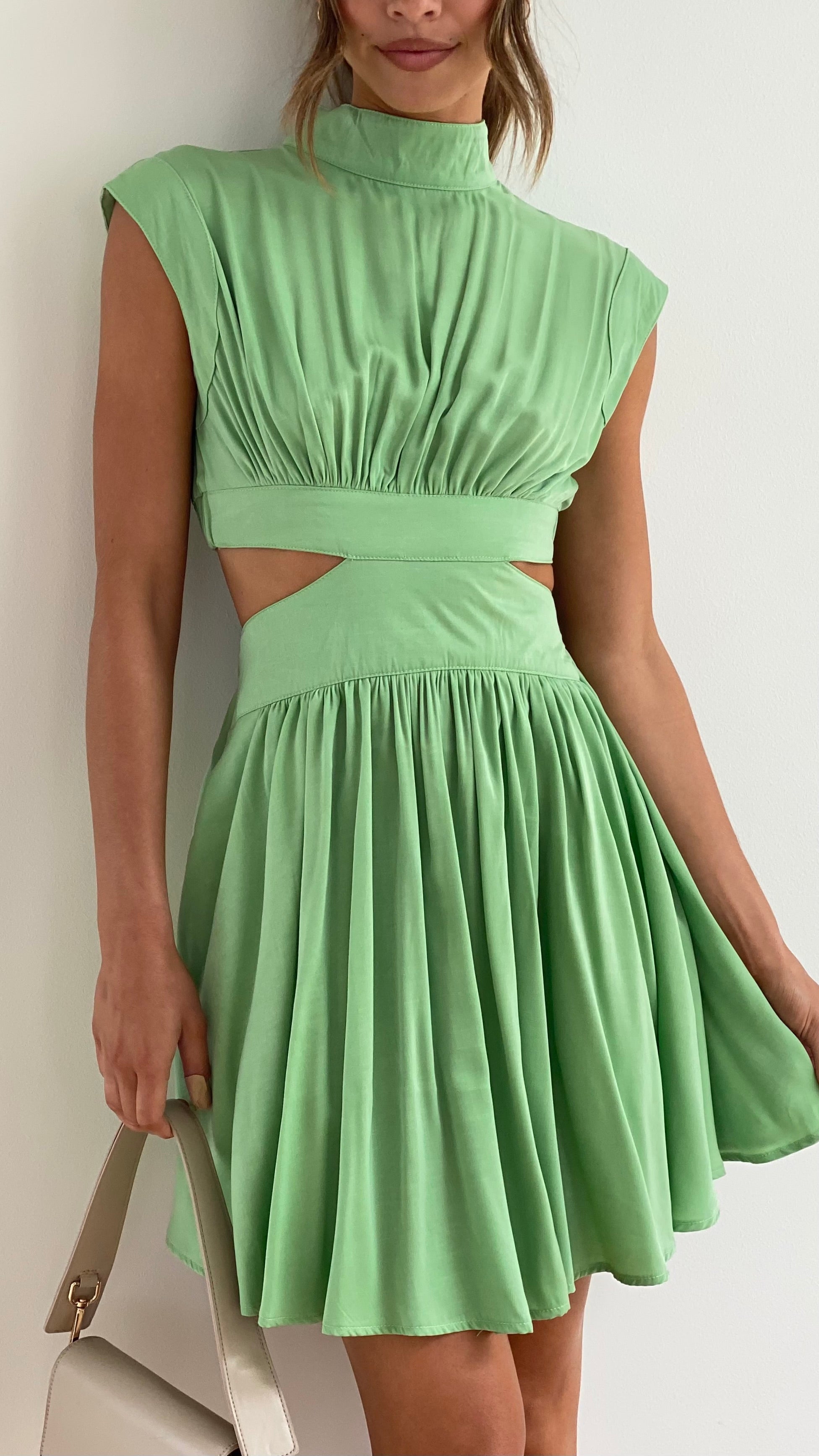 Sleeveless Mock Neck Ruched Bodice Side Cut Out Pleated Skater Mini Dress